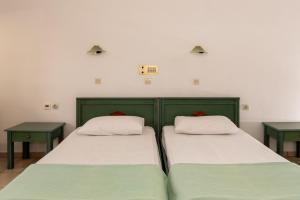 Postel nebo postele na pokoji v ubytování Elpis Studio Apartments