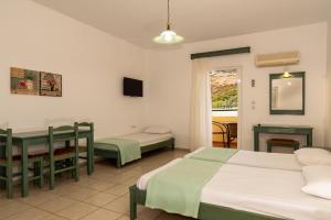 Postel nebo postele na pokoji v ubytování Elpis Studio Apartments