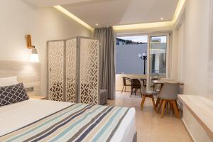 Postel nebo postele na pokoji v ubytování Elpis Studio Apartments + 37 fotografií