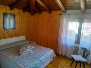 Postel nebo postele na pokoji v ubytování Appartamento Caprioli