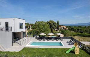 an external view of a villa with a swimming pool at Villa Ani Krsan in Potpićan