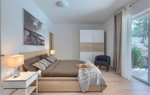 a bedroom with a bed and a desk and a window at Villa Tila in Pazin