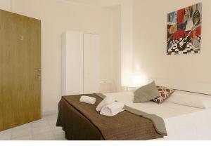 A bed or beds in a room at Al Colosseo 8