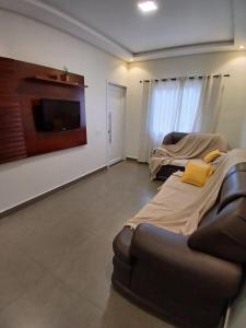 a living room with two beds and a couch at Iguassu Falls Refuge - Cataratas do Iguassu - Paraguai - Argentina in Foz do Iguaçu