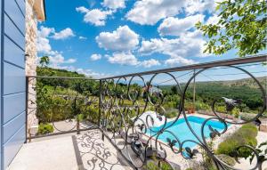 a view from the balcony of a villa with a swimming pool at Villa Amore in Bribir