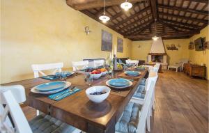 a wooden table with plates and bowls of fruit on it at Villa Elizabeta in Umag