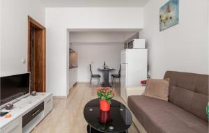 a living room with a couch and a table at 1 Bedroom Awesome Apartment In Vrh in Vrh