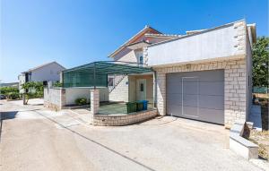 a white brick house with a garage at Awesome Apartment In Plano With Wifi in Plano