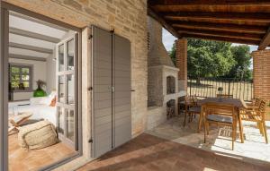 an outdoor patio with a door and a table at Villa Maria Selina in Selina