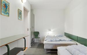 Postel nebo postele na pokoji v ubytování Fanø Bad, Lejl, 11