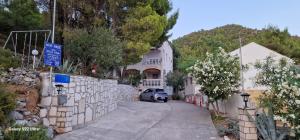 a car parked in front of a house at Vila Una in Žuljana