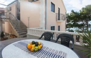 a bowl of fruit on a table on a balcony at Lovely Apartment In Jesenice With Wifi in Jesenice +22 photos