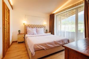 Postel nebo postele na pokoji v ubytování Villa Eliyas near the Pirin Golf Resort