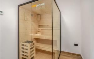 a sauna in a glass case in a room at Awesome Home In Stari Laz With Kitchen in Stari Laz