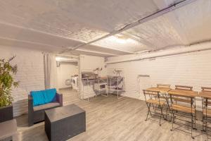 an empty room with a table and chairs at La Marine - Centre ville - Wifi in Lens