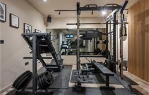 a gym with several treadmills and weights at Beautiful Home In Srima in Srima