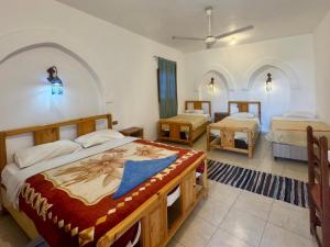 Postel nebo postele na pokoji v ubytování Hotel Sheherazade Luxor