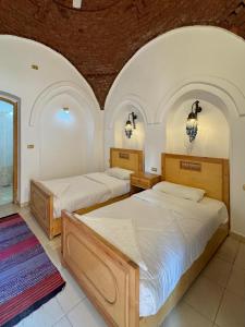 Postel nebo postele na pokoji v ubytování Hotel Sheherazade Luxor