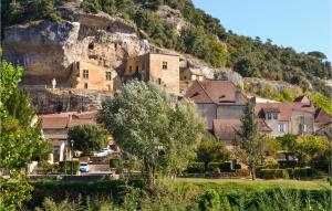 a village in front of a mountain at Les 3 Oies in Sarlat-la-Canéda