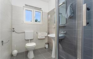 a bathroom with a toilet and a sink at 2 Bedroom Nice Apartment In Pinezici in Pinezici +29 photos