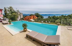 a swimming pool in a house with at Awesome Home In Lovran With Sauna in Lovran