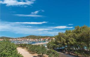 a marina with a bunch of boats in a harbor at One-Bedroom Apartment In Jezera in Jezera +12 photos