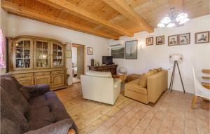 a living room with two couches and a tv at Amazing Home In Novi Vinodolski in Novi Vinodolski