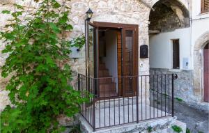 an entrance to a stone building with a wooden door at Lovely Apartment In Caramanico Terme in Caramanico Terme +14 photos