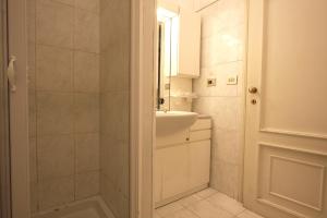 a bathroom with a shower and a sink and a mirror at Lovely studio in Campo de Fiori in Rome