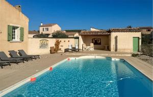 a swimming pool in front of a house at Lovely Home In St Maurice Sur Eygues in Saint-Maurice-sur-Eygues