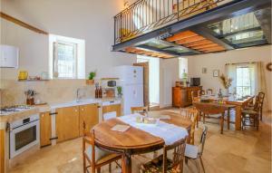 a kitchen and dining room with a table and chairs at Beautiful Home In Banne in Banne