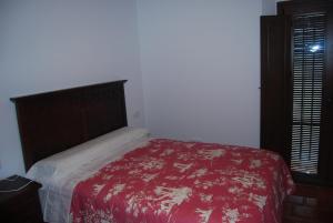 Łóżko lub łóżka w pokoju w obiekcie Apartamentos Bodeguetas
