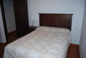 Łóżko lub łóżka w pokoju w obiekcie Apartamentos Bodeguetas