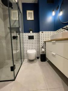 Kúpeľňa v ubytovaní Apartment Wola Tower + 26 fotografií