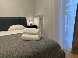 Posteľ alebo postele v izbe v ubytovaní Apartment Wola Tower