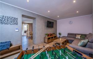 a living room with a pool table in the middle at 2 Bedroom Nice Home In Barban in Jurićev Kal