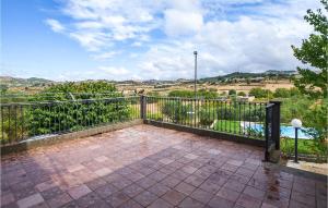 a balcony with a fence and a view of the countryside at Cozy Home In Monterosso Almo in Monterosso Almo