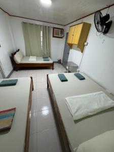 Postel nebo postele na pokoji v ubytování Em's Homestay