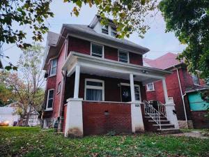 a red brick house with a white trim at Home besides Niagara Falls, NY in Niagara Falls