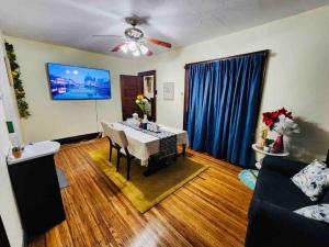 a living room with a table and a couch at Home besides Niagara Falls, NY in Niagara Falls