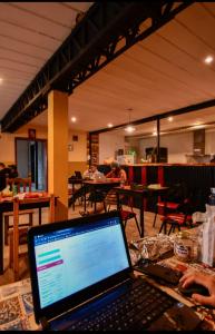 a laptop computer sitting on top of a table at Mistico Hostel 23 in El Chalten