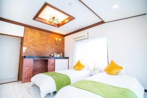 A bed or beds in a room at Miraie Yokkaichi Simizucho 2