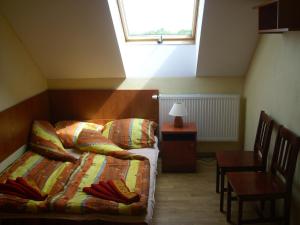 Postel nebo postele na pokoji v ubytování Zajazd Pułaskiego