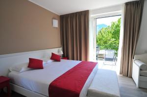 Postel nebo postele na pokoji v ubytování Hotel Resort Le Vele