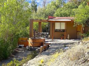 a small house with a hot tub in front of it at Casa rural en el Valle de Elqui in Vicuña
