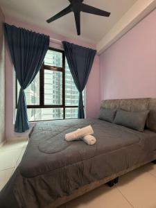 a large bed in a room with a large window at E LIFE D Summit Residences 1315 Wifi Netflix in Johor Bahru