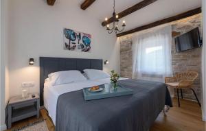 Ένα ή περισσότερα κρεβάτια σε δωμάτιο στο Villa Flego