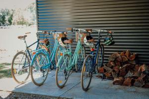 two bikes parked next to each other next to a garage at Lusso - Boutique Accommodation in Whitfield