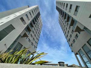 two tall buildings standing next to each other at Torres al mar 10 in Monte Hermoso +8 photos