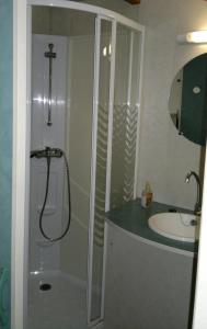 a bathroom with a shower and a sink at Camping Bungalows Mariola in Bocairent